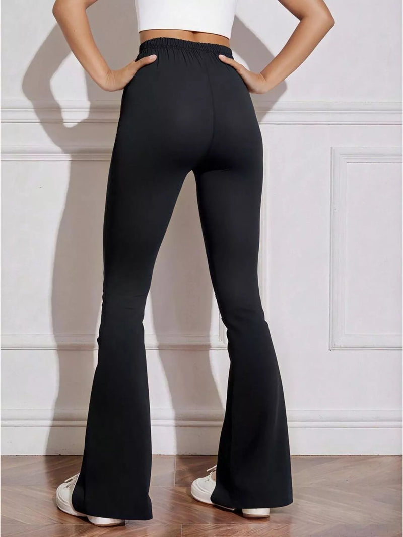 High Waisted Flare Pants for Women with Stretch Knit and Bow Detail in Black, studio back view