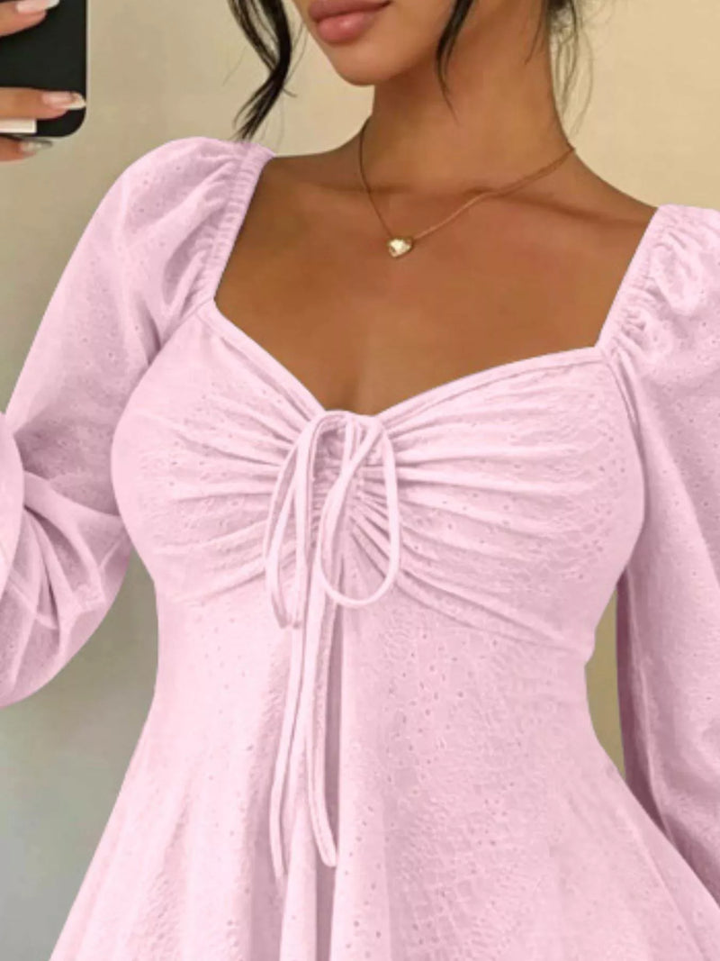 Long Sleeve Tie Front Top for Women with Sweetheart Neck and Peplum Hem in Pink, close-up