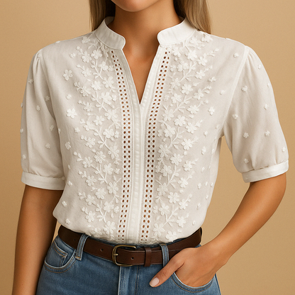Women’s white elegant blouse with classic collar and button closure, perfect for work, leisure, or evening wear.
