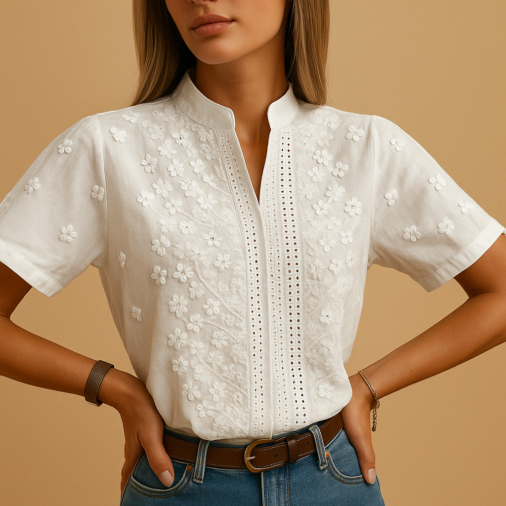 Women’s white elegant blouse with classic collar and button closure, perfect for work, leisure, or evening wear.