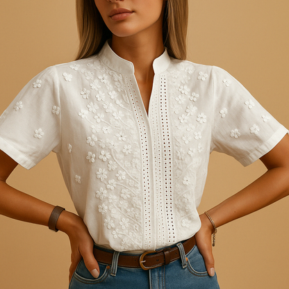 Women’s white elegant blouse with classic collar and button closure, perfect for work, leisure, or evening wear.