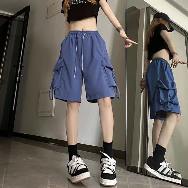 Wide Leg Cargo Shorts for Women with Drawstring Waist and Flap Pockets in Blue, mirror view