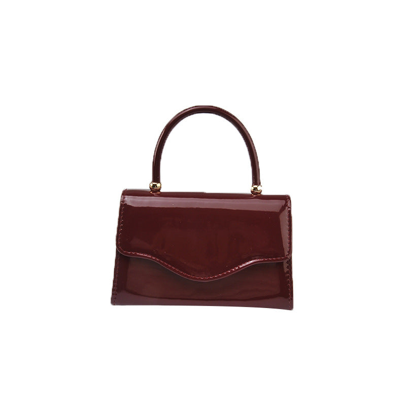 Women's Patent Finish Single Strap Evening Clutch Bag in Burgundy, front view
