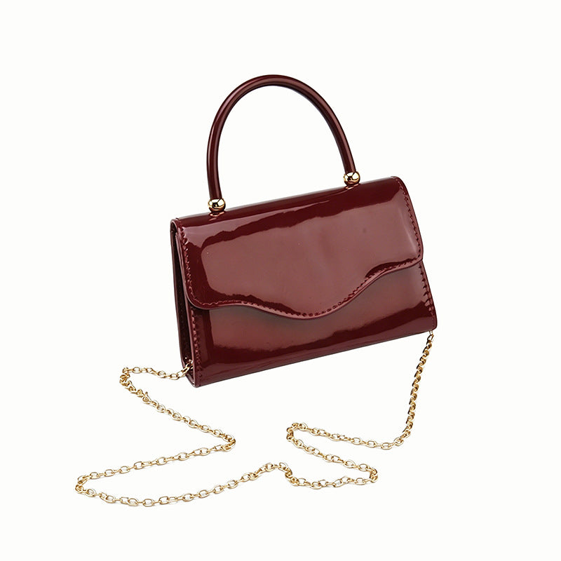 Women's Patent Finish Single Strap Evening Clutch Bag in Burgundy, side view