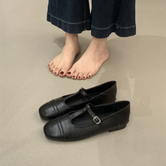 Women's Round Toe T-Strap Mary Jane Flats in Black, front view