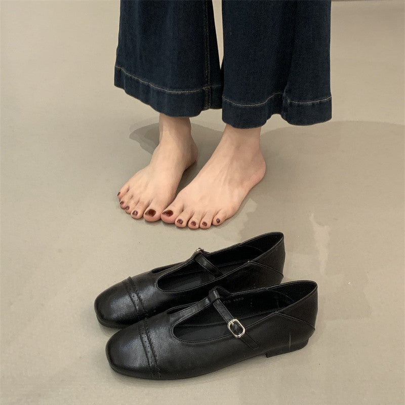 Women's Round Toe T-Strap Mary Jane Flats in Black, front view